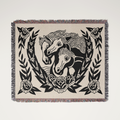 Woven blanket with black horse design on a beige background